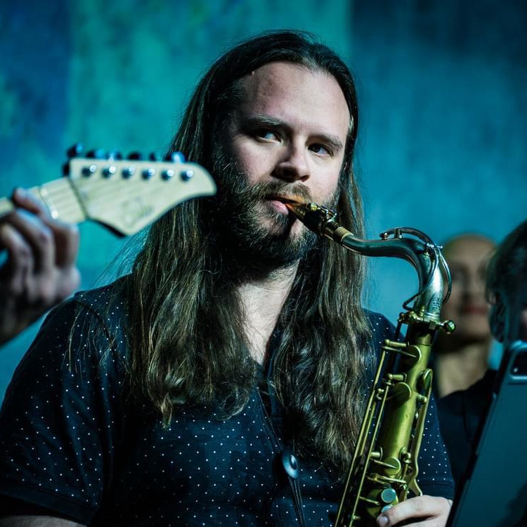 Lucas playing saxophone